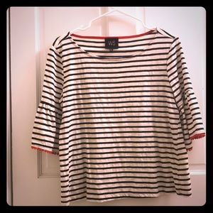 Black and white striped shirt with red dot trim